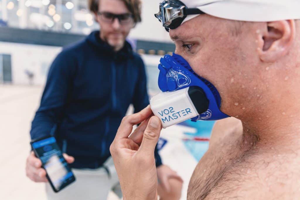 Kristian Blummenfelt wearing VO2 Master Analyzer at swimming pool