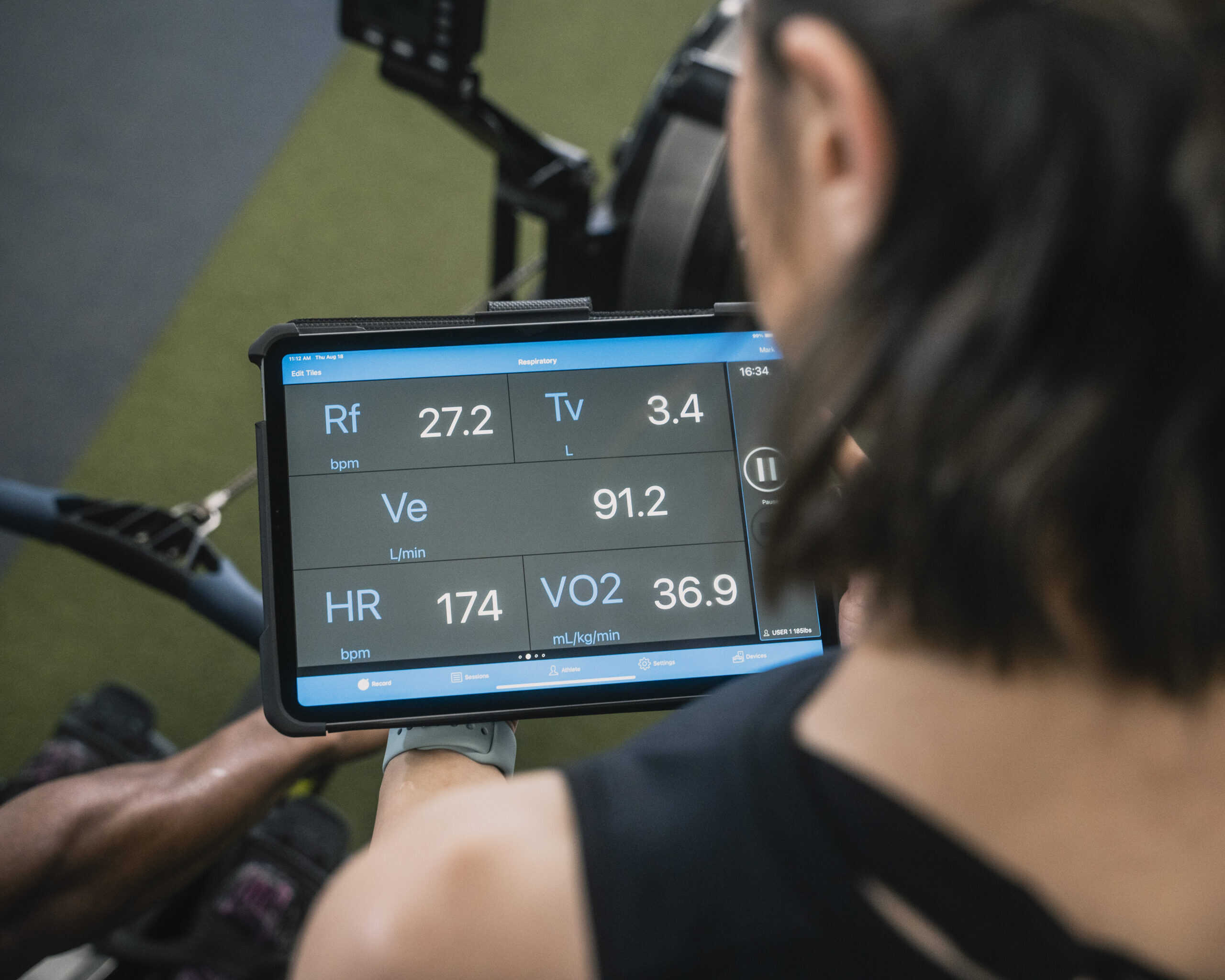 Athlete reviewing VO2 Master metabolic testing results on a tablet