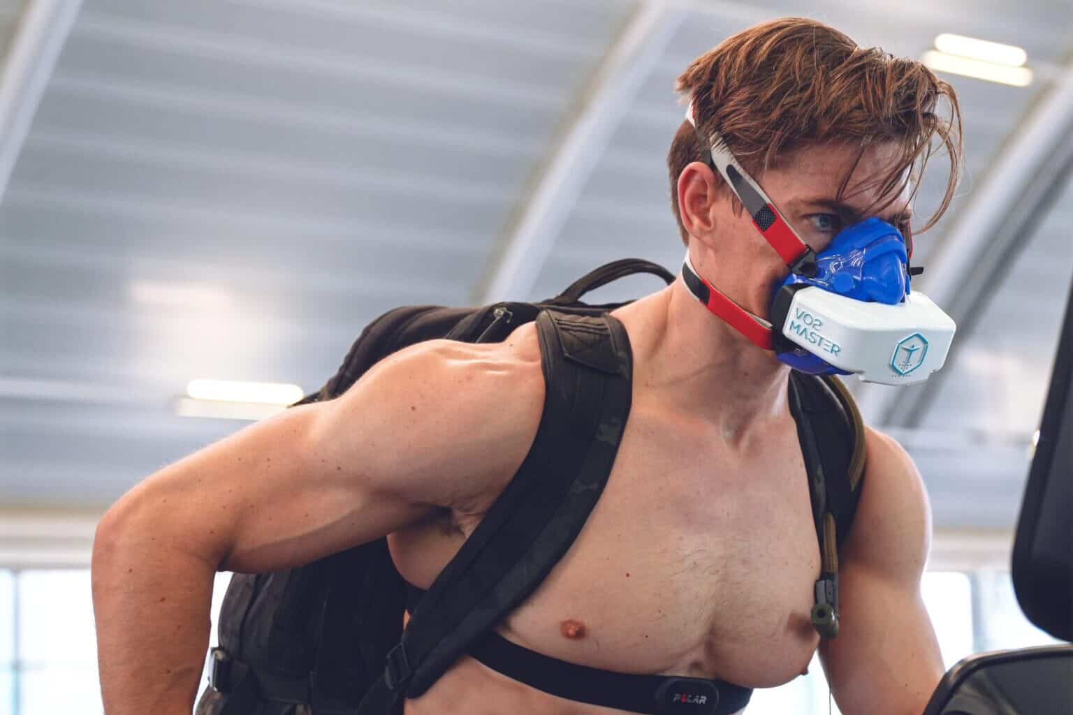 Jack Hanrahan running on treadmill wearing VO2 analyzer and backpack