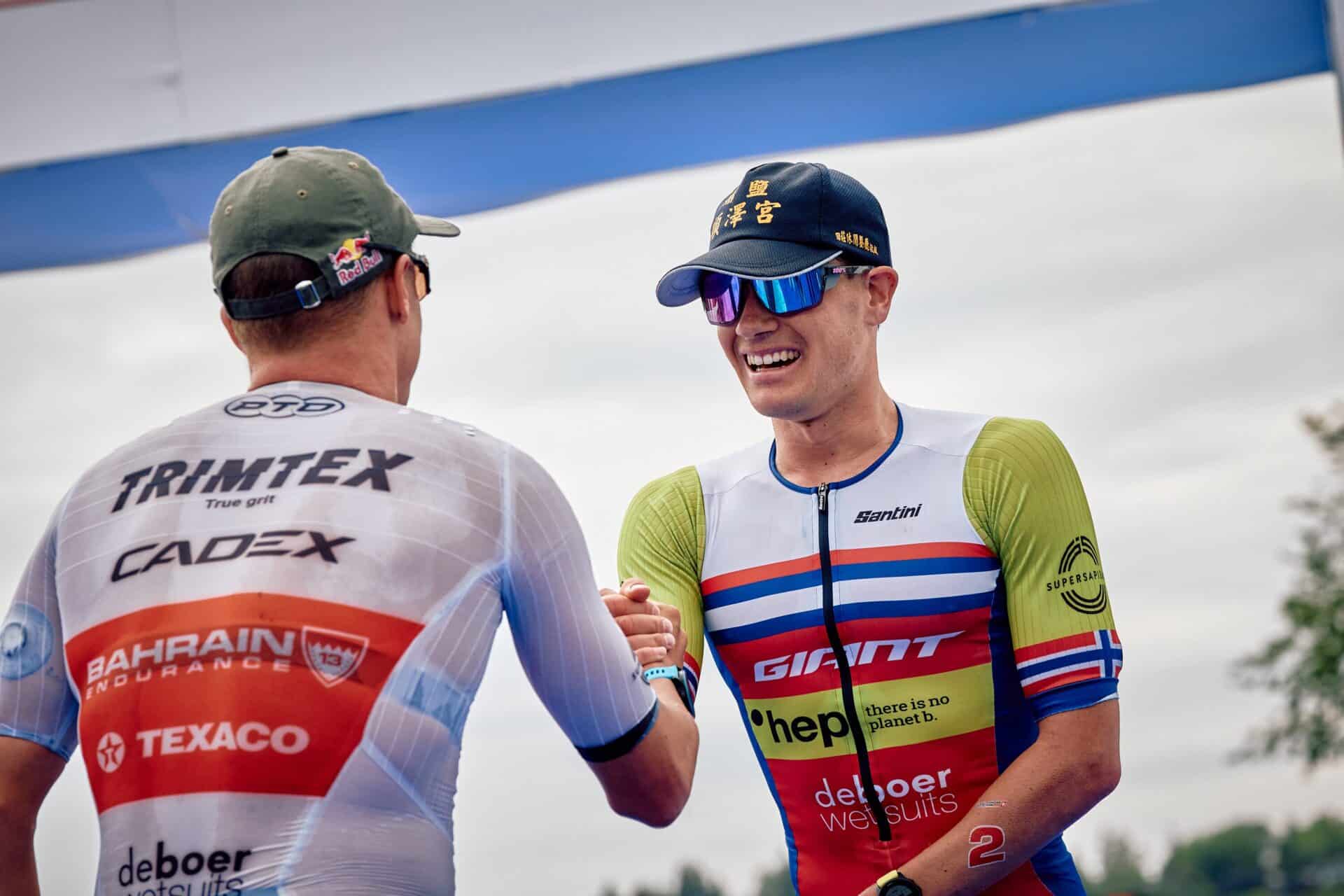 Pro Triathlete Kristian Blummenfelt and Gustav Iden shaking hands after a race