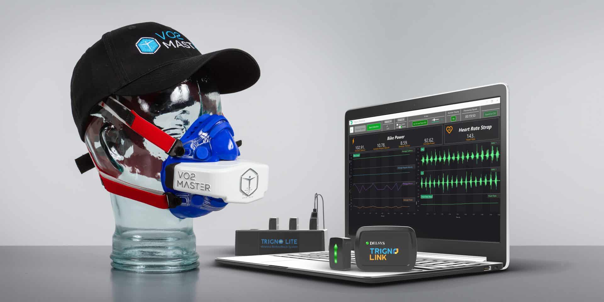 Mannequin wearing VO2 analyzer and hat next to laptop