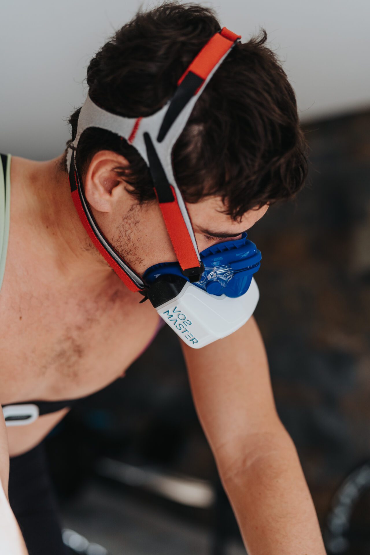 professional triathlete training on the indoor bike in a lab while using the vo2 master portable metabolic analyzer