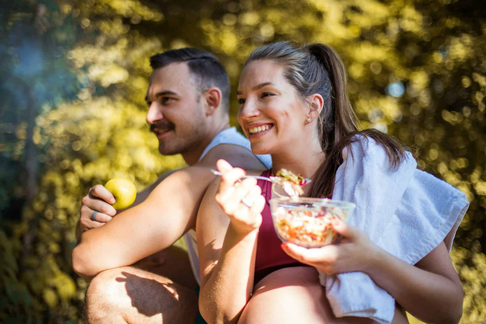 nutrition for triathletes with two people eating healthy foods after training