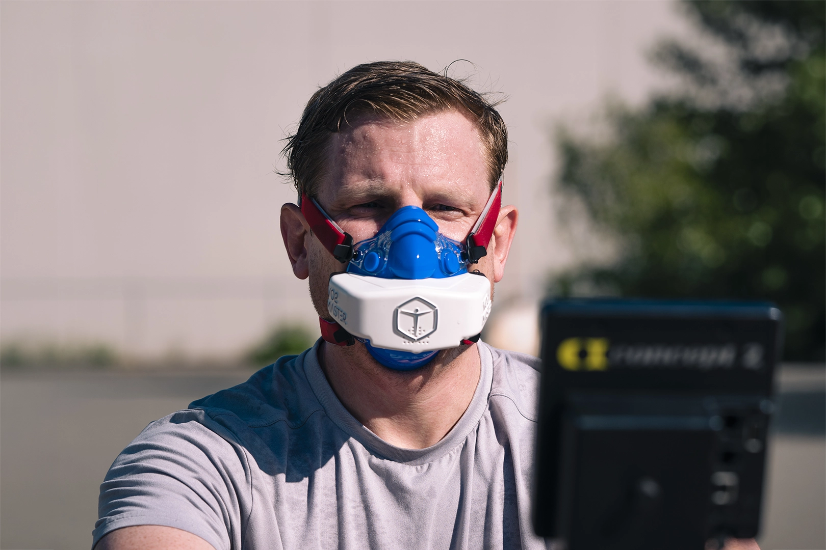 Firefighter wearing a VO2 Master Analyzer during outdoor metabolic testing in summer.