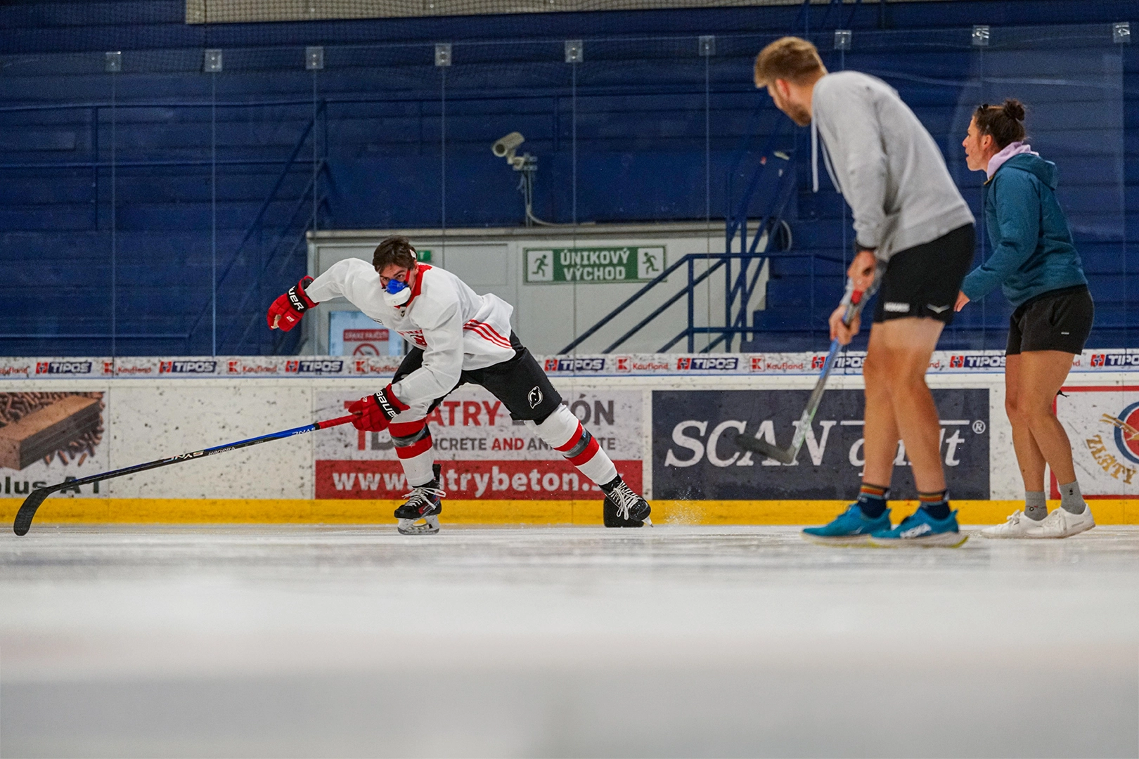 Simon Nemec wearing a VO2 Master Analyzer while skating on the ice during sport-specific performance testing.